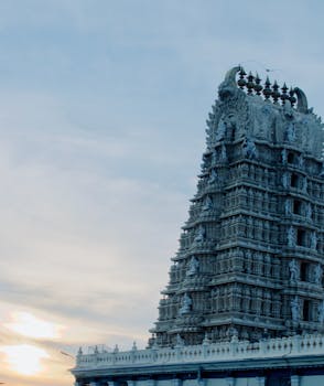 The ornate Chamundeshwari Temple in Mysuru, India, captured against a serene evening sky.